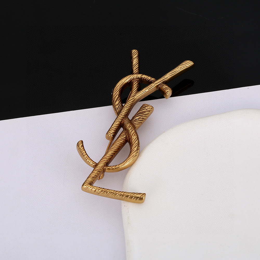 YSL brooch
