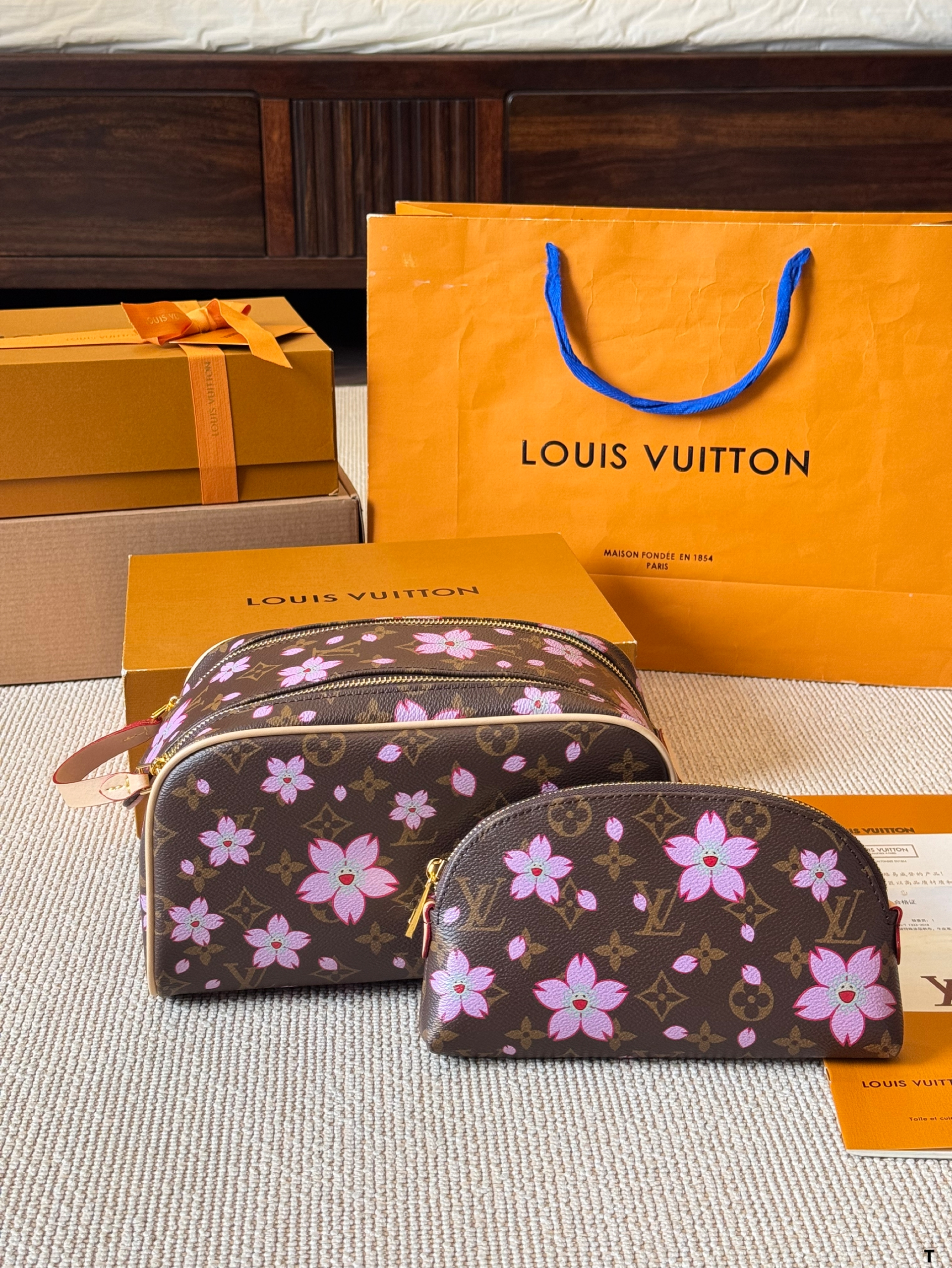 LV hand-held cosmetic bag
