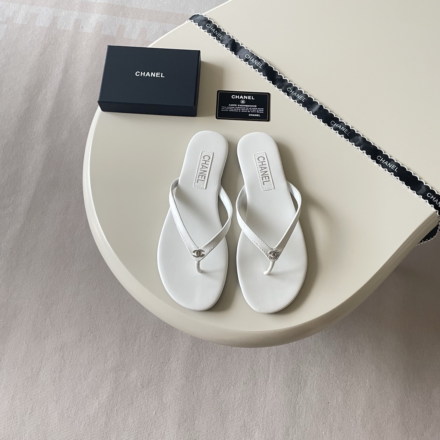 Chanel Embellished Logo Flip-Flops - Black & White