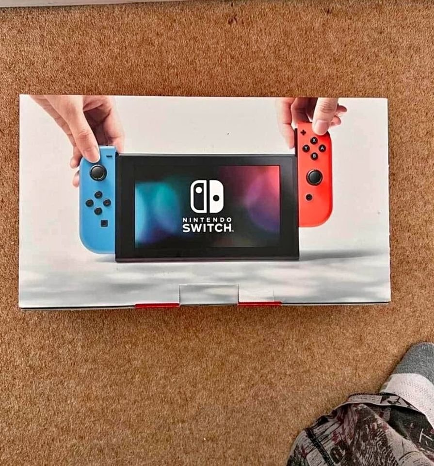 Nintendo Switch with Neon Blue and Neon Red Joy Con –