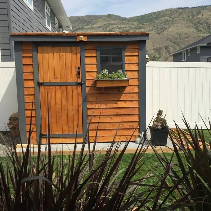 8.5 ft wide x 4.5 ft deep solid wood inclined storage shed