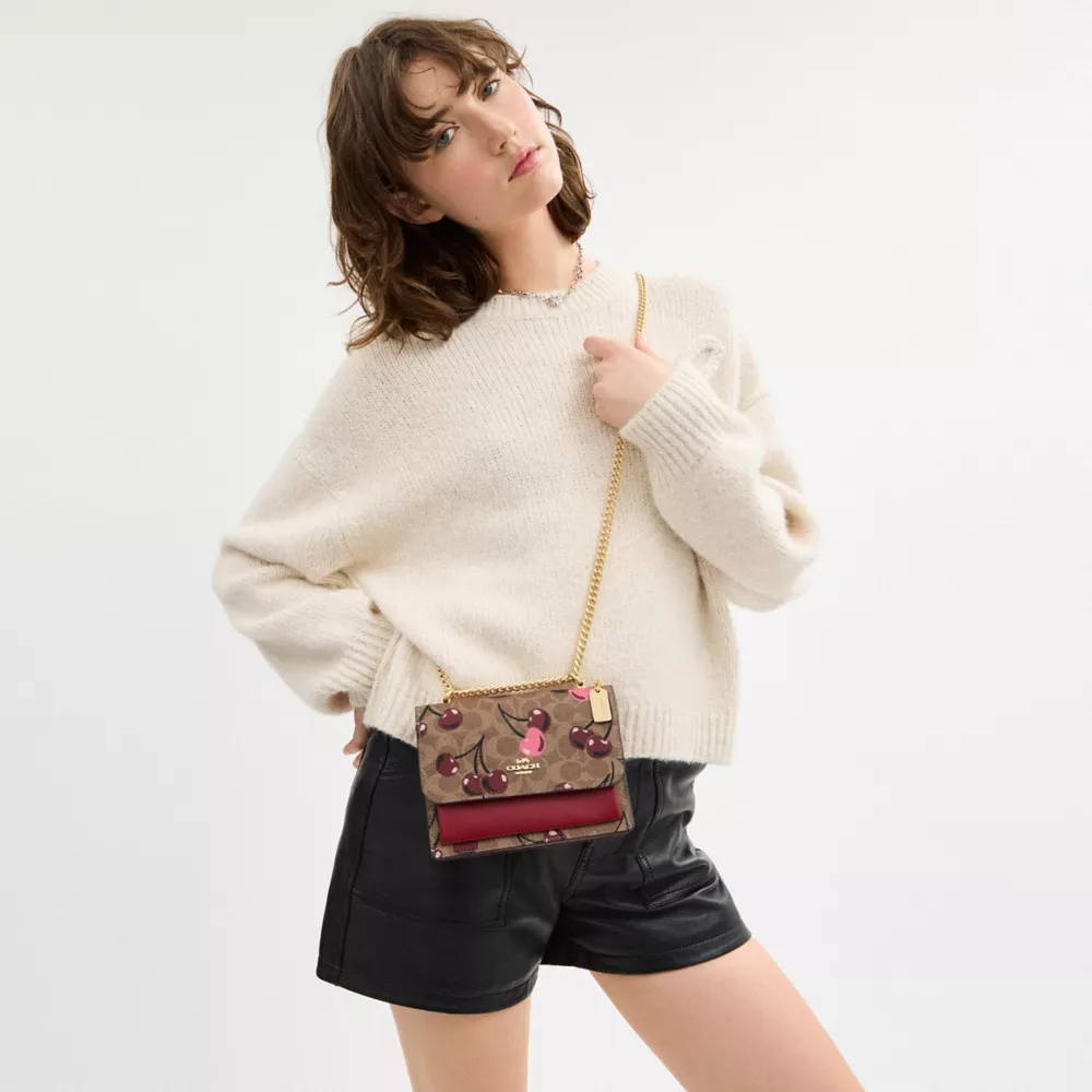 Mini Klare Crossbody Bag In Signature Canvas With Cherry Print