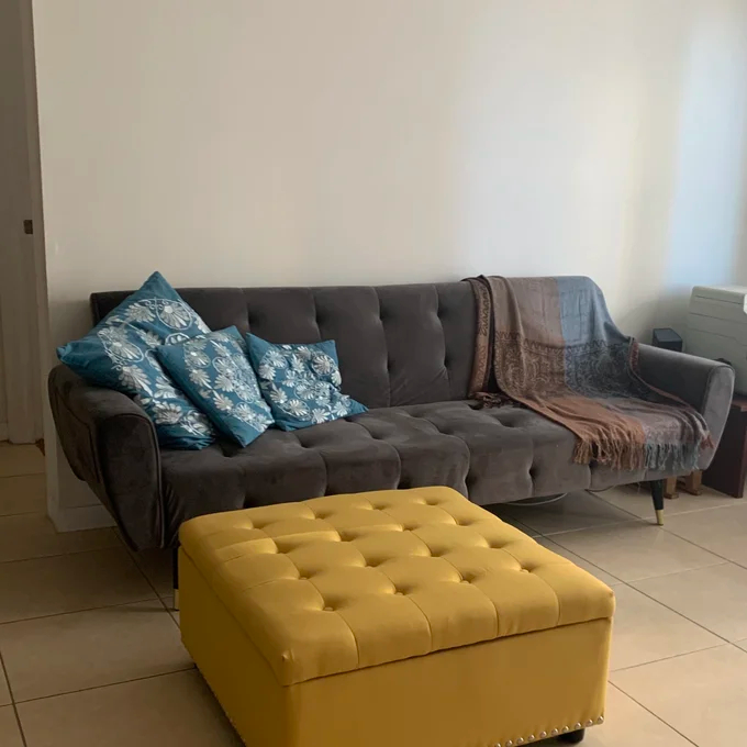A sofa wrapped in flannel.