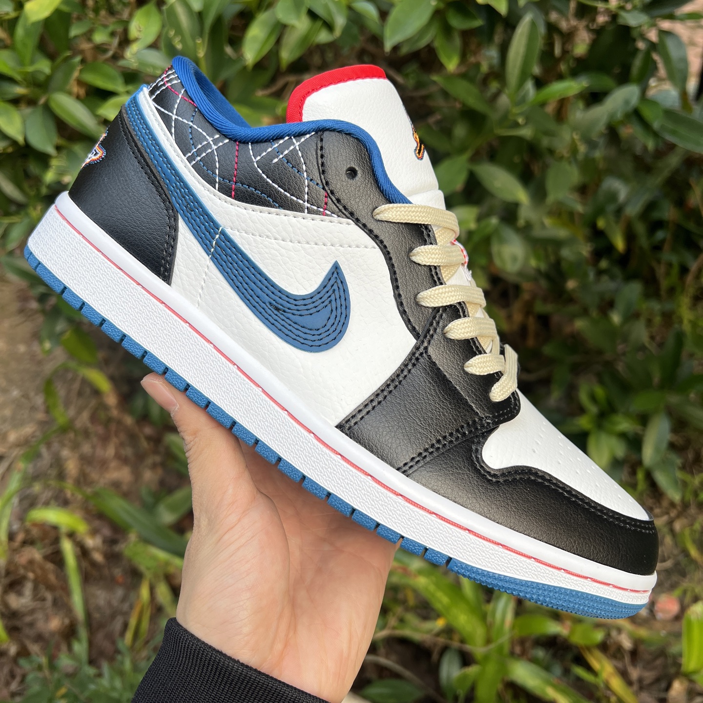AJ1 Low in black, white and blue with embroidery