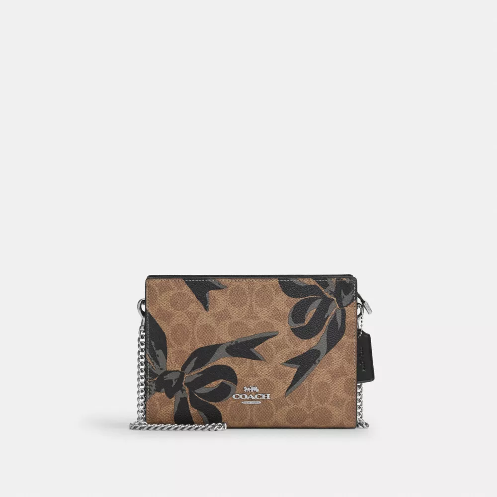 Slim Crossbody Bag In Signature Canvas With Bow Print