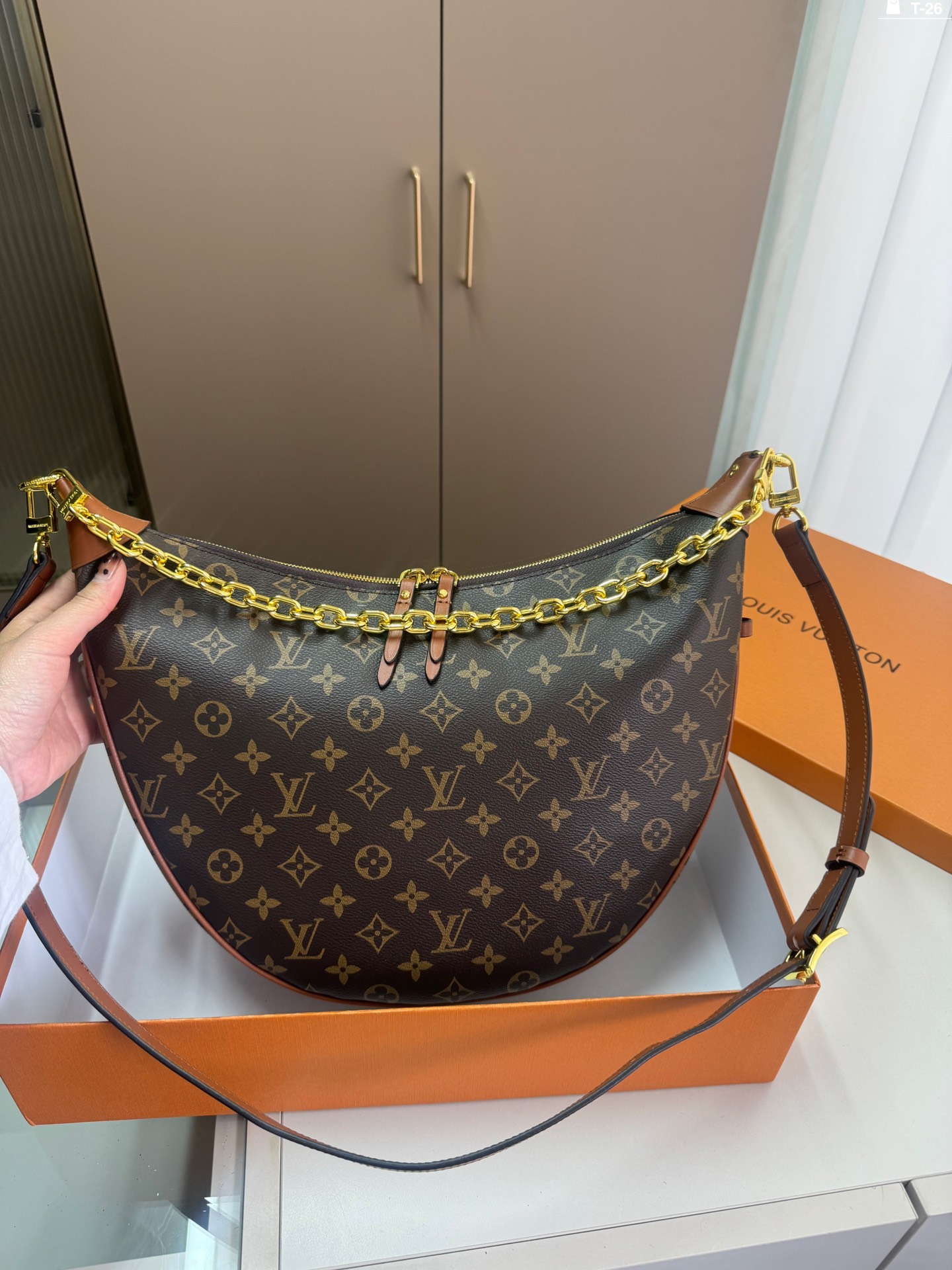 LV crescent-shaped bag chain strap shoulder bag