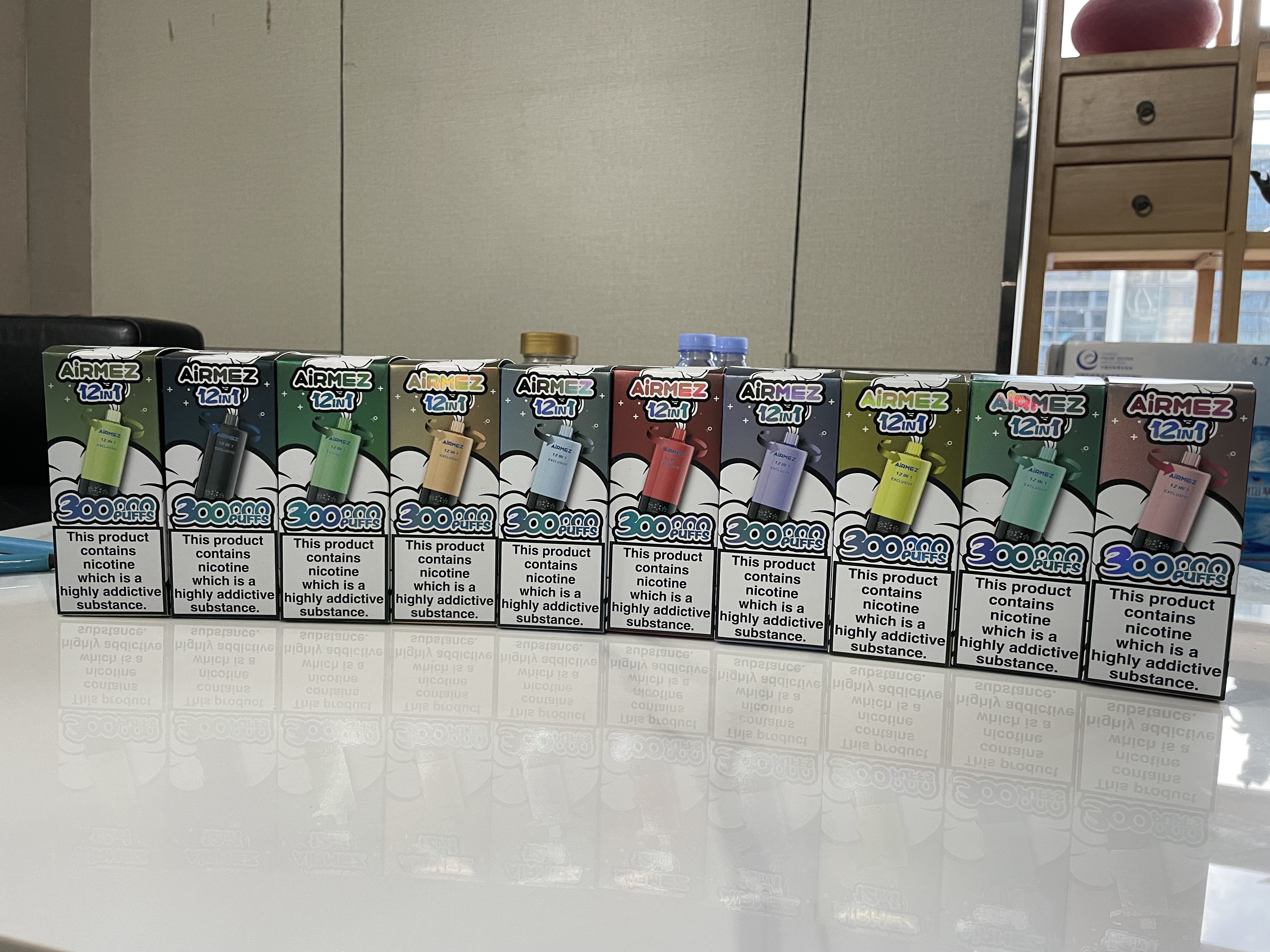 AiRMEZ Exclusive 12-in-1 300K retail packaging lineup showing multiple flavor editions