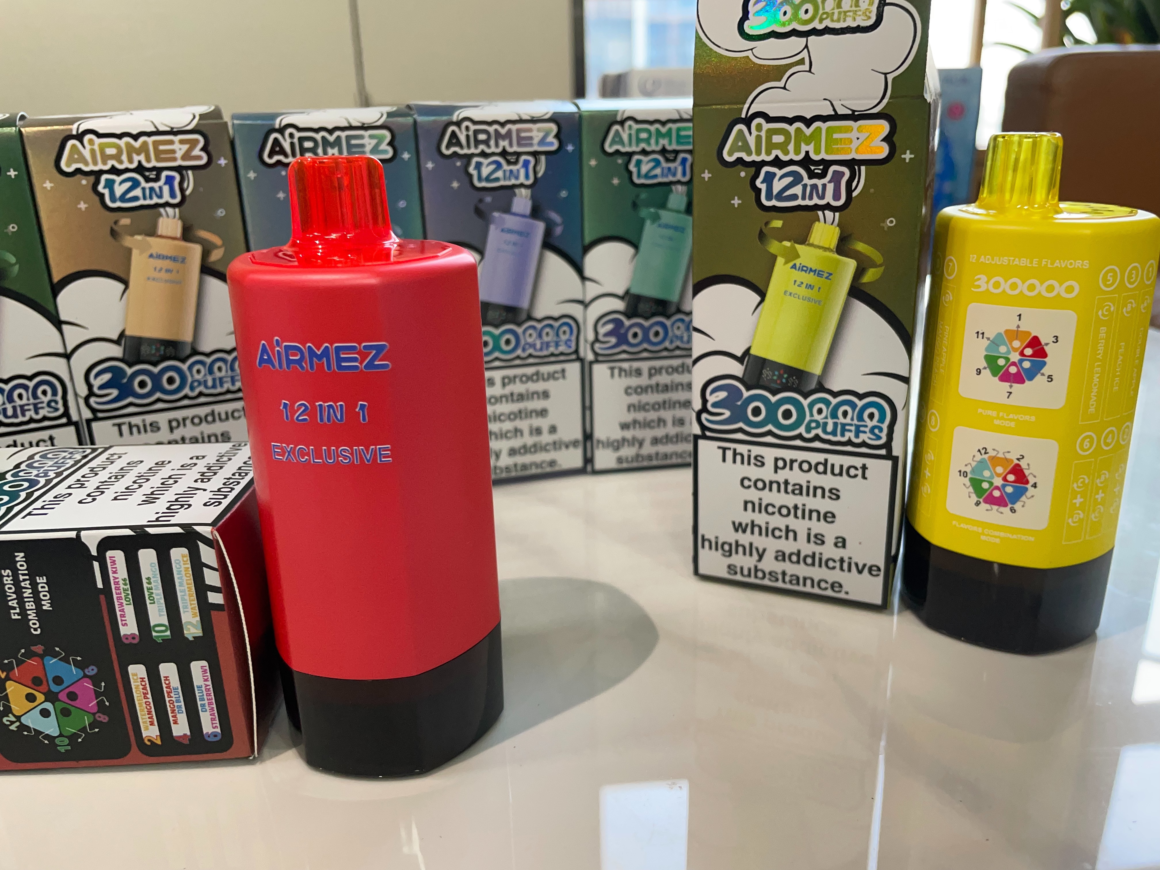 AiRMEZ Exclusive 12-in-1 300K real product photo with retail packaging and flavor mode design