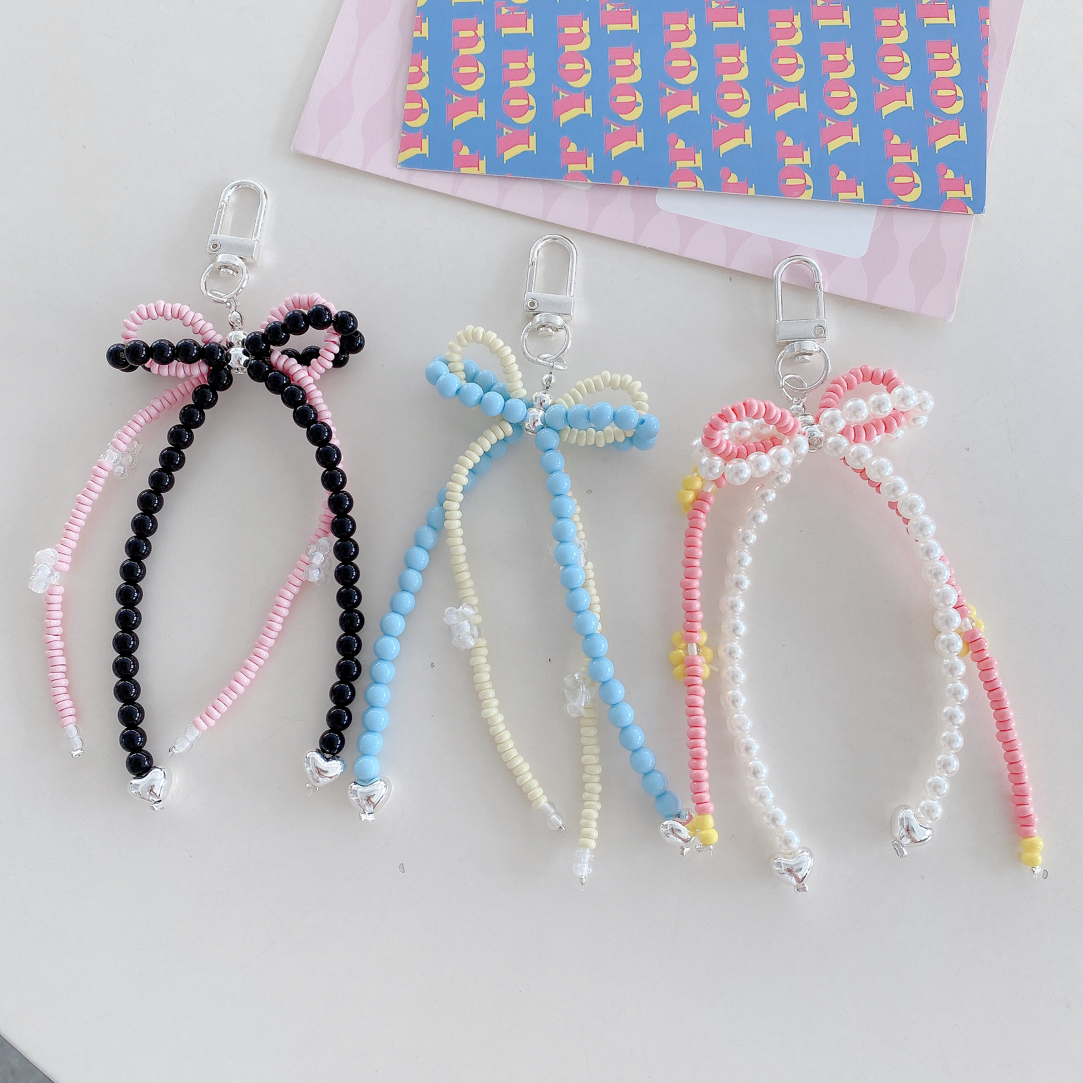Playful Beaded Bow Phone Charms