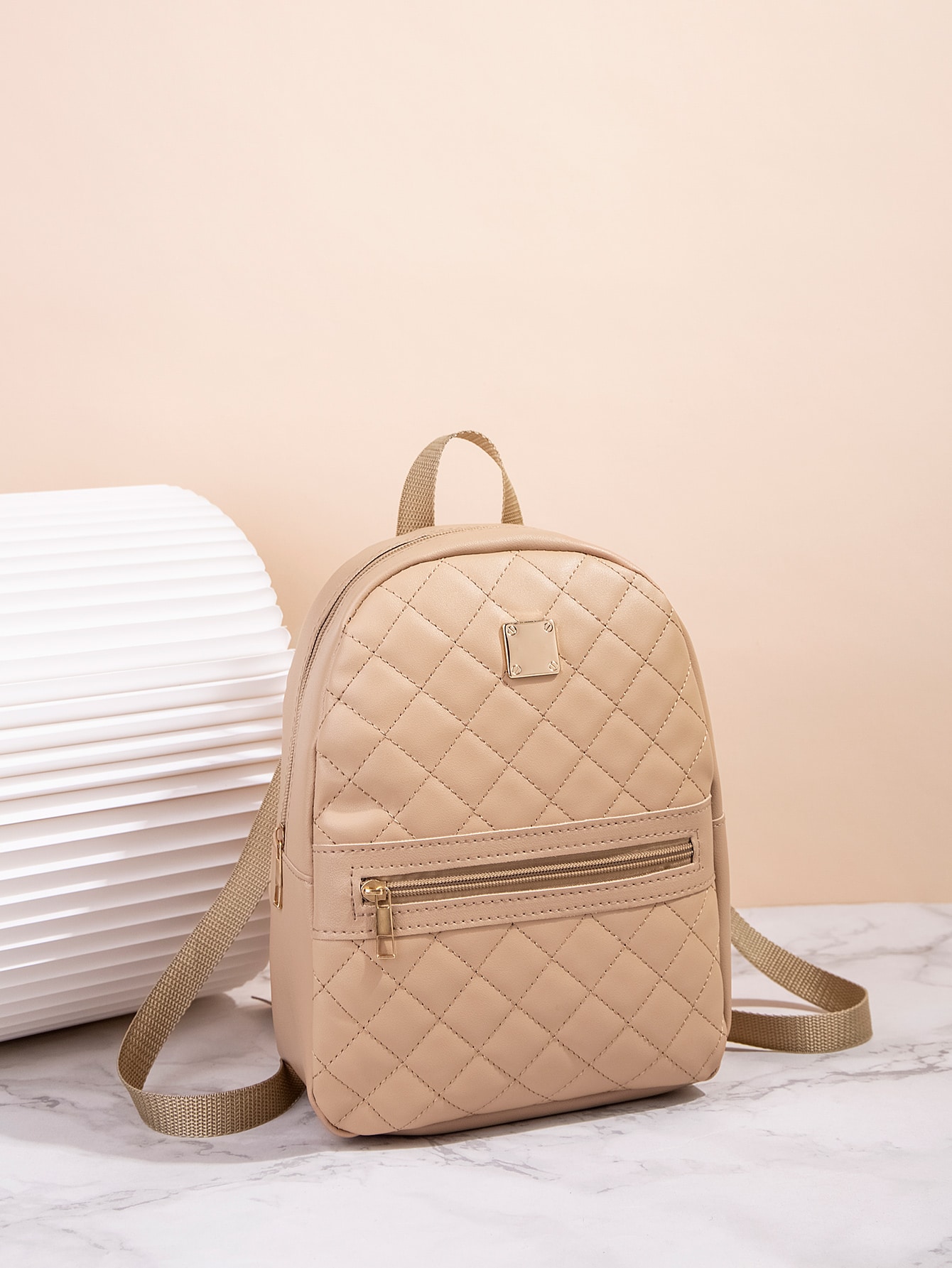 Quilted pattern front zipper back backpack