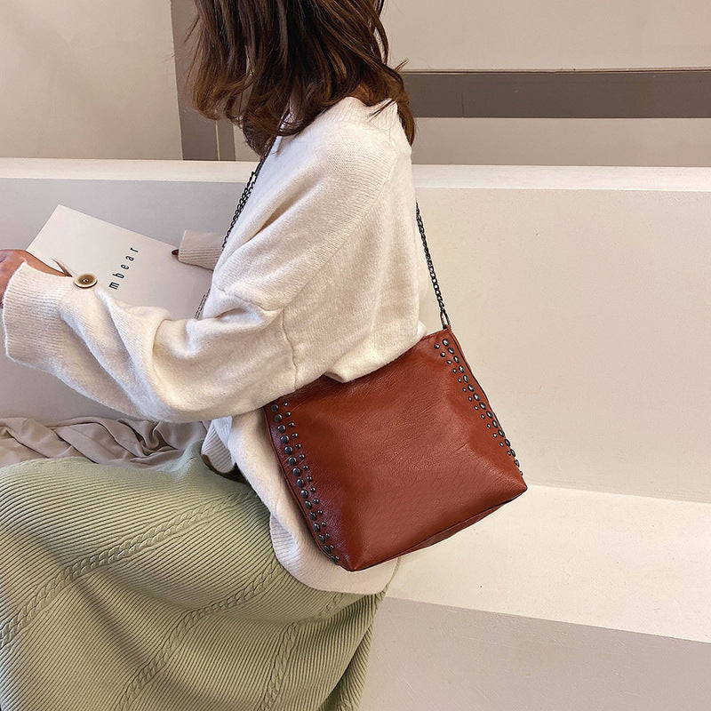 Winter new female bag retro style large capacity one-shoulder bucket bag soft leather rivet messenger bag