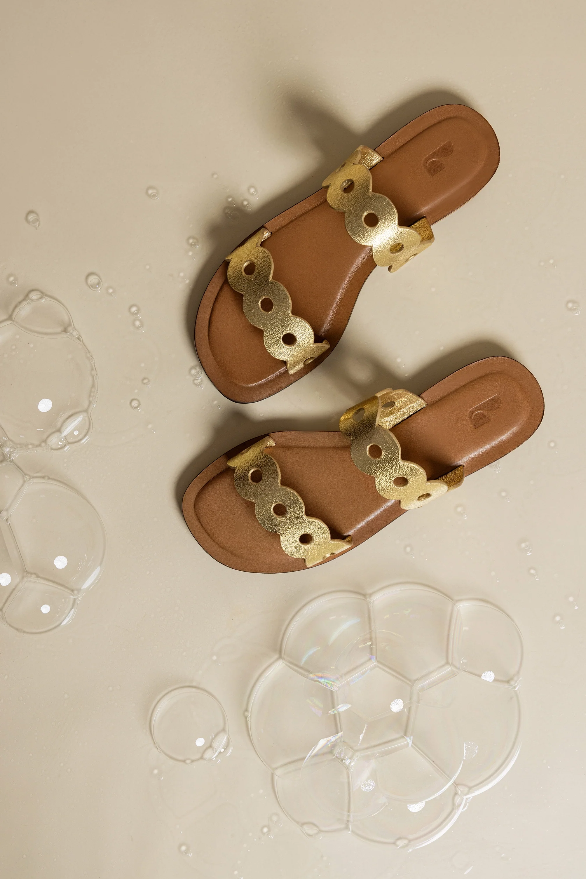 Florence Flat Mule In Gold Metallic Leather