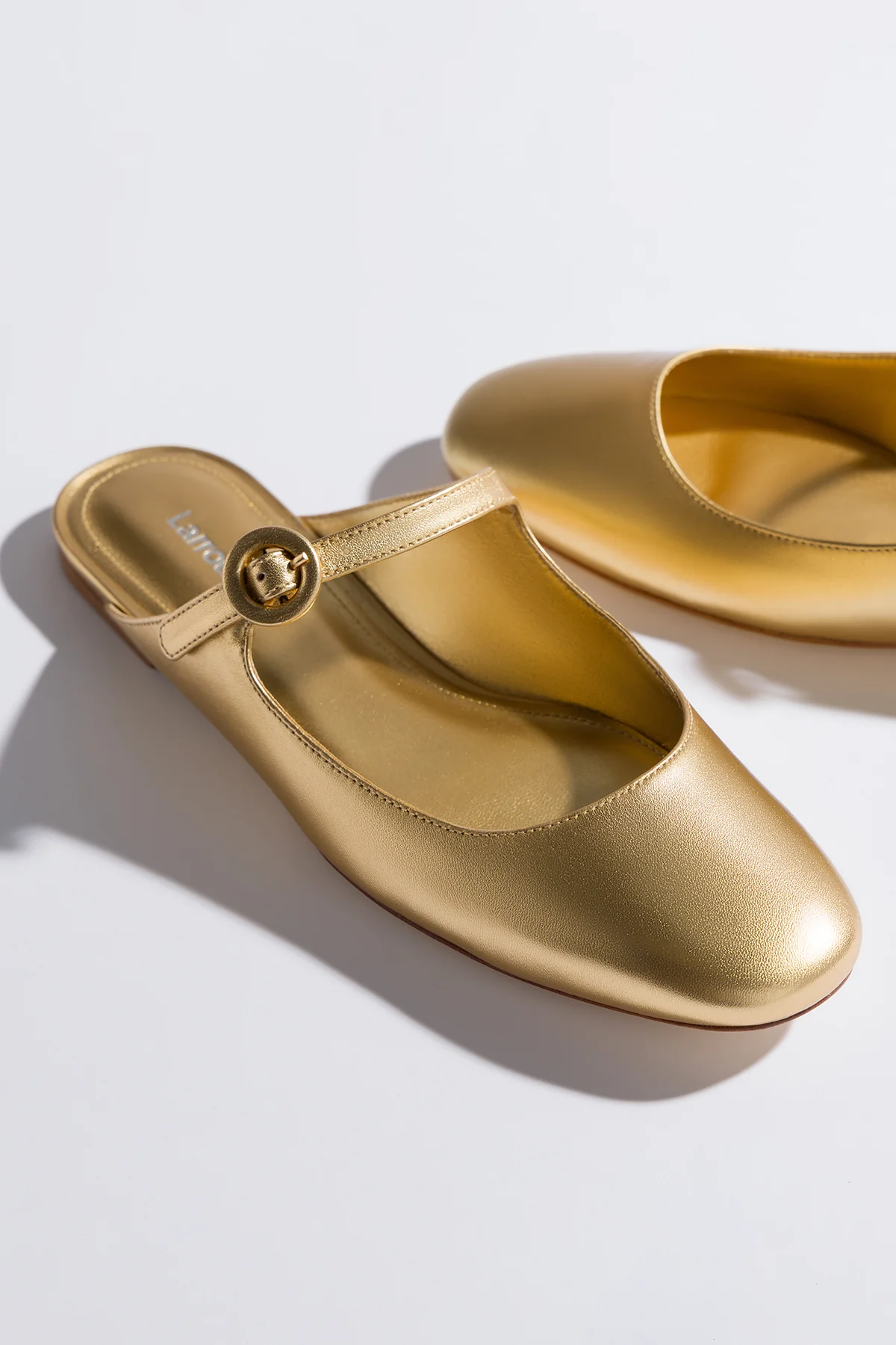 Blair Flat Mule In Gold Metallic Leather