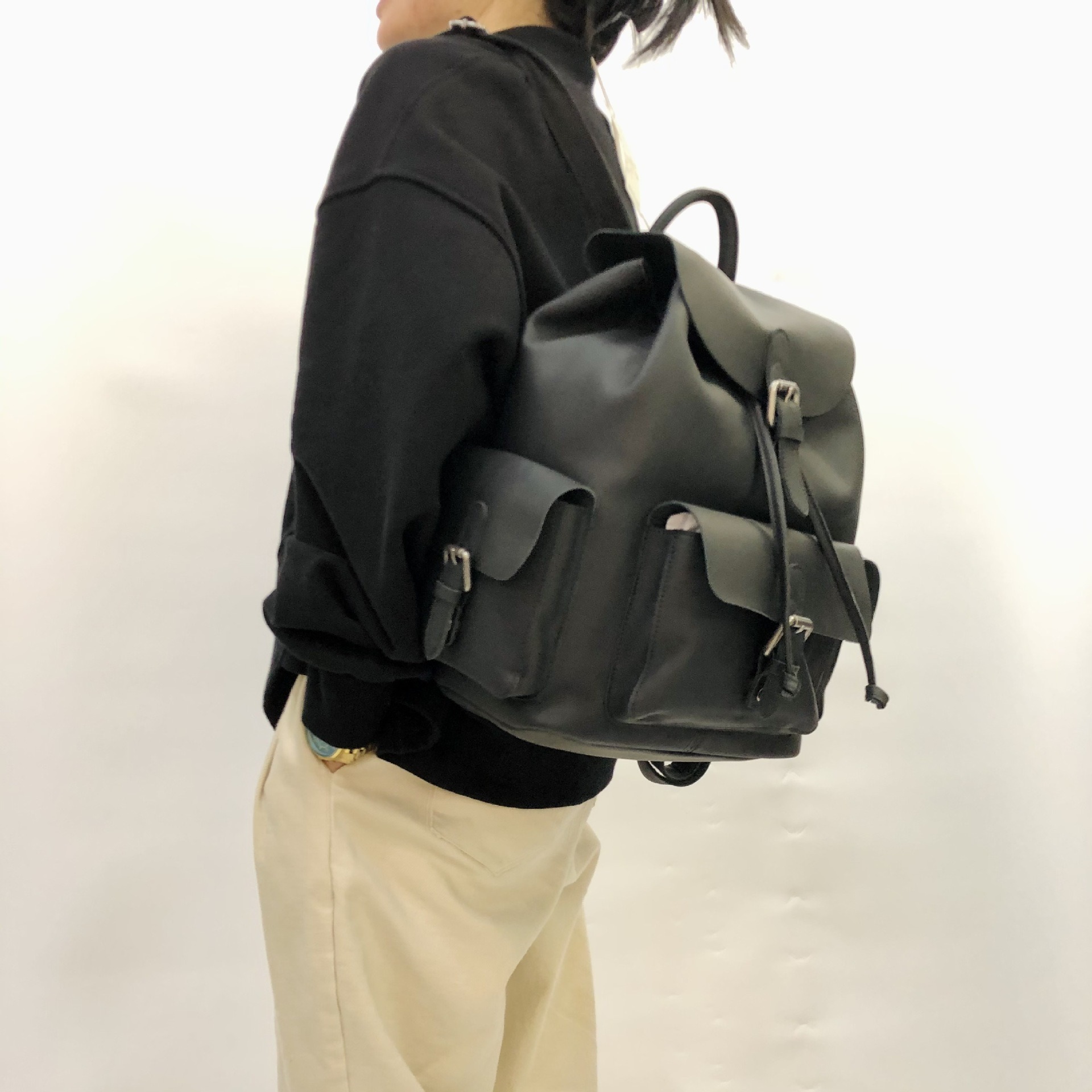 Genuine Leather Backpack with Flap and Drawstring Closure
